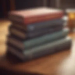 A stack of classic investment books on a wooden desk